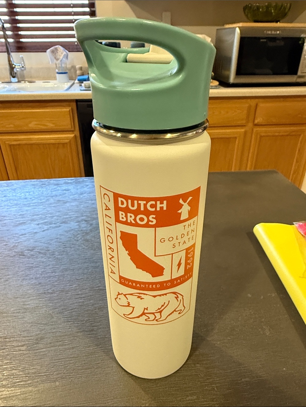 Dutch Bros California White Bottle with Mint Green Handle and Orange Logo